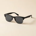The Brow in Matte Black polarized sunglasses, front three-quarter view